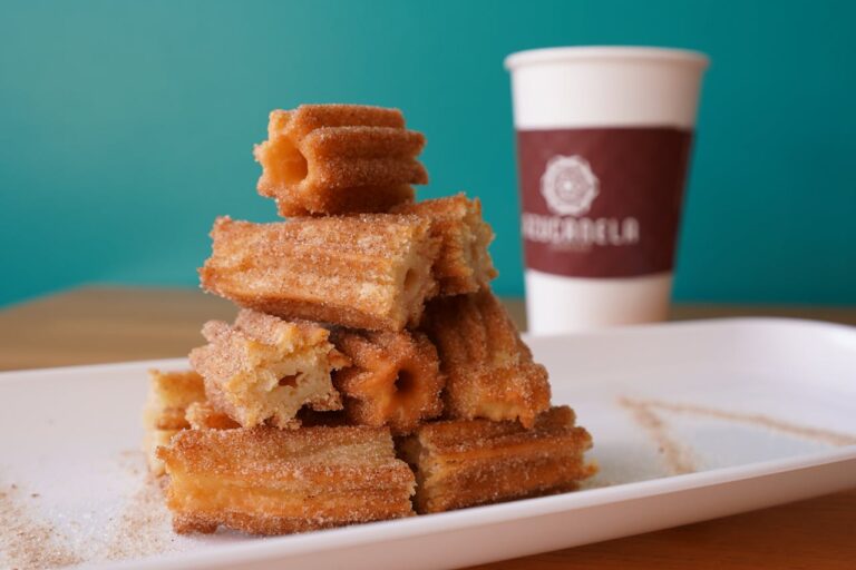 A tempting stack of cinnamon sugar churros with coffee in Azusa, California.